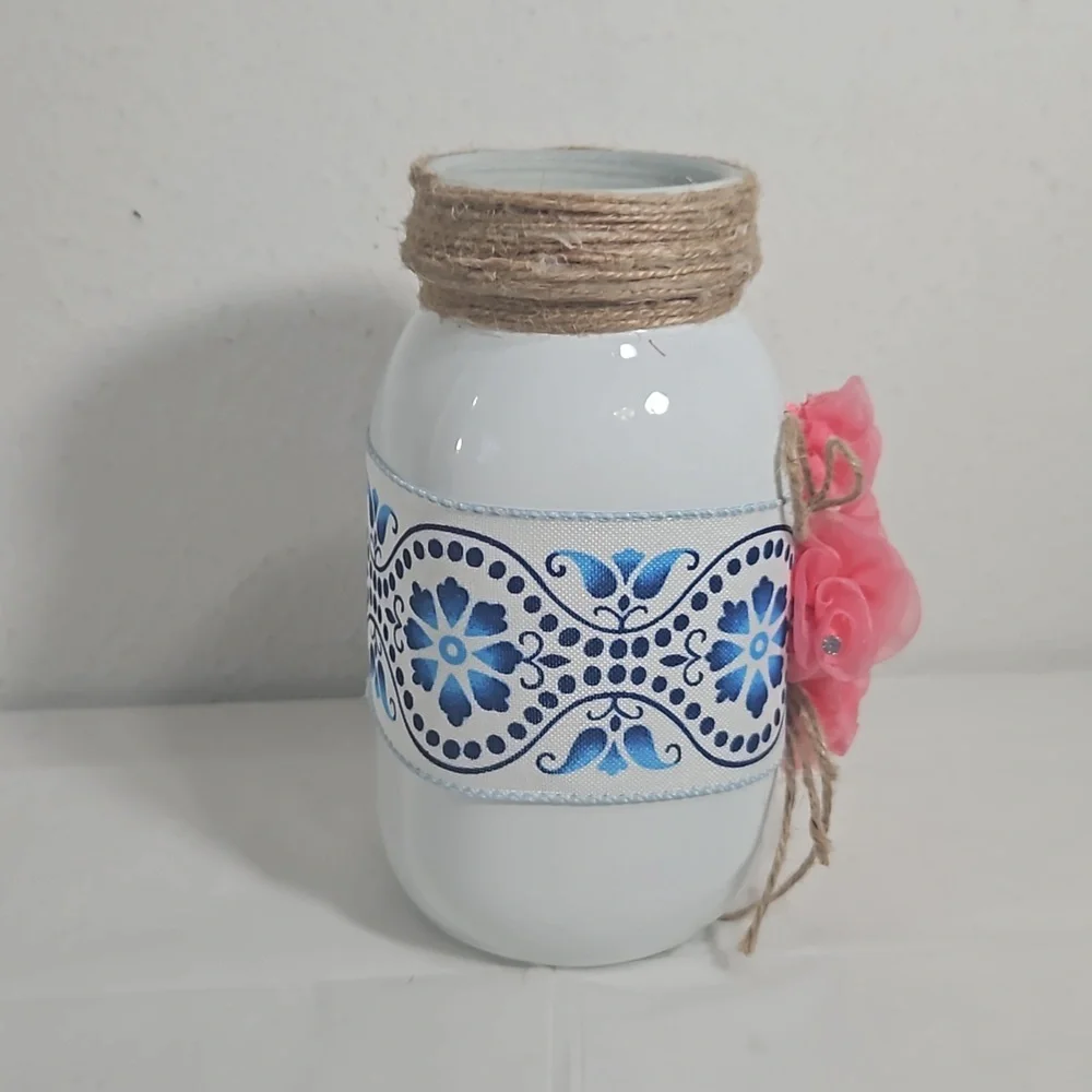 handmade white mason jar with floral blue ribbon and pink flower cross